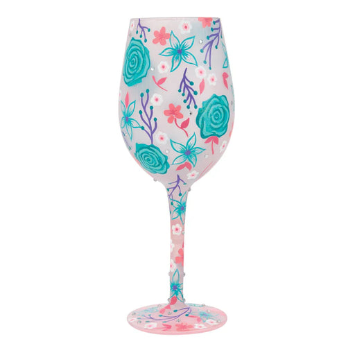 Wine glass with floral pattern on a white background