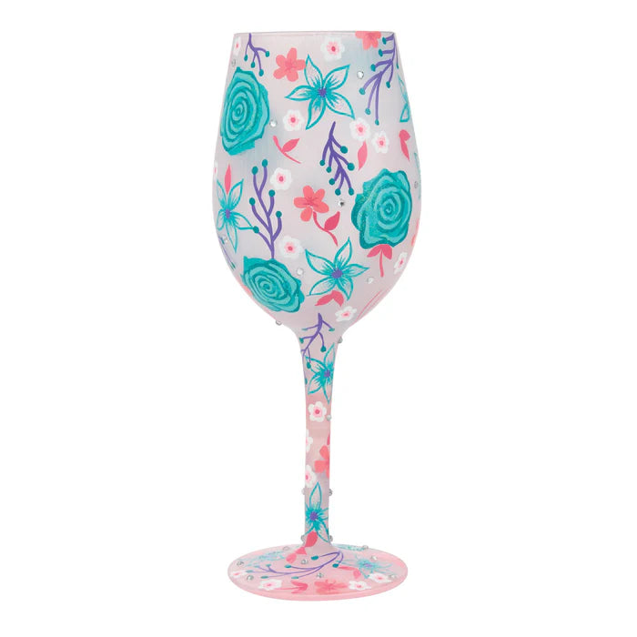 Wine glass with floral pattern on a white background