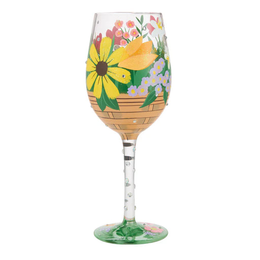 Wine glass with floral design on a white background