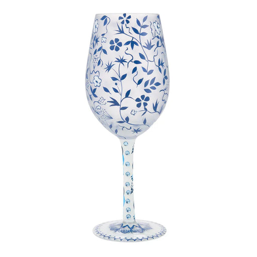 Wine glass with blue floral patterns on a white background