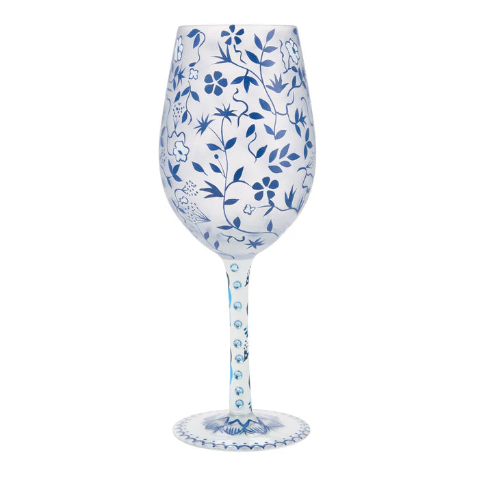 Wine glass with blue floral patterns on a white background