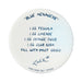 Round white coaster with blue text listing a cocktail recipe and brand name on a white background