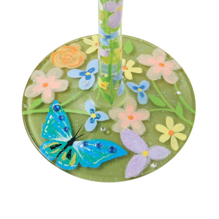 Decorative glass coaster with butterflies and flowers on a white background