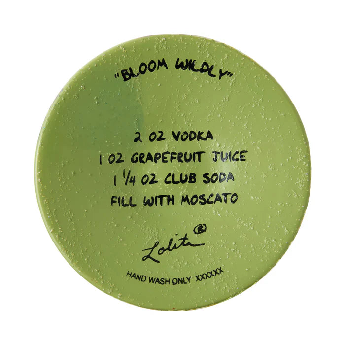 Green round coaster with black text and branding on a white background