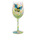 Wine glass with butterfly and floral design on a white background