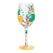 Decorative wine glass with colorful designs on a white background