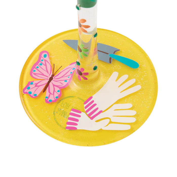 Colorful children's play set with a yellow base featuring a butterfly and hands design.