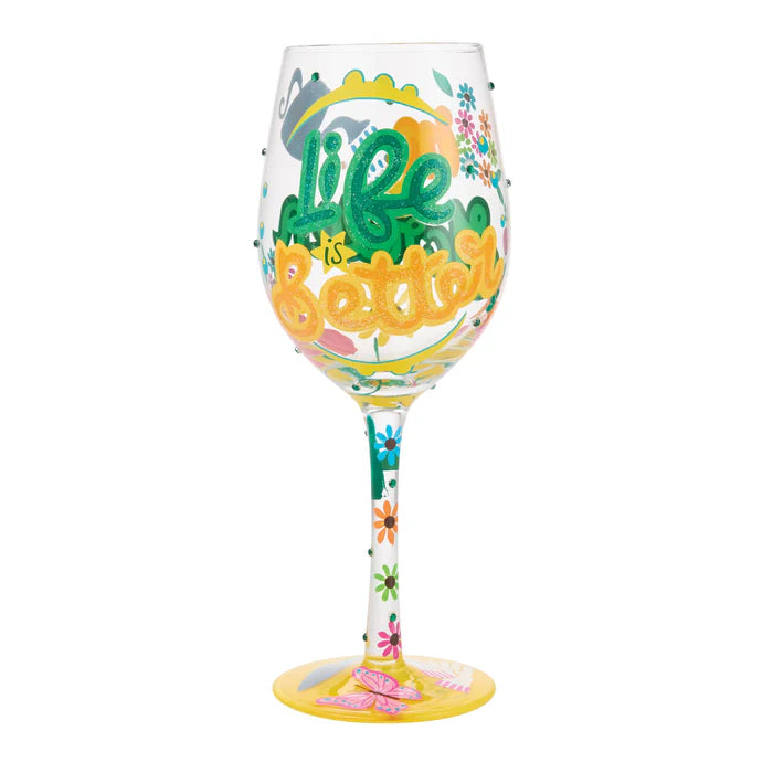 Decorative wine glass with 'Life is Better' text and colorful designs on a white background