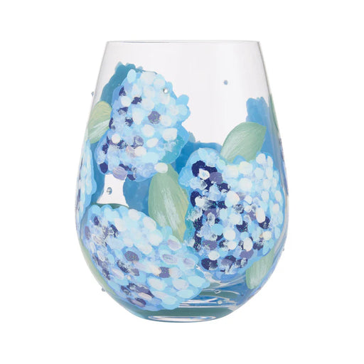 Stemless wine glass with blue floral design on a white background