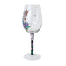 Decorative wine glass with colorful floral design on a white background