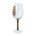 Decorative wine glass with floral design on a white background
