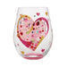 Decorative glass with a pink heart design on a white background