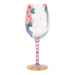 Decorative wine glass with floral design on a white background