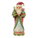 Festive Santa nutcracker figurine holding a Christmas tree and gifts on a white background