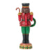 Decorative nutcracker figurine with red and green colors on a white background