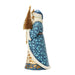 Santa figurine with blue and gold accents holding a gold Christmas tree on a white background