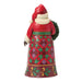 Festive Santa figurine holding a wreath with poinsettias on a white background