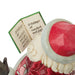 Santa Claus figurine with a book that says "O tidings of comfort and joy, comfort and joy! O tidings of comfort and joy!"