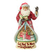 Santa Claus figurine with a book and Carolers scene on a white background