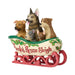 Decorative figurine of a sleigh with dogs inside with the phrase 'Santa's Rescue Sleigh' on a white background