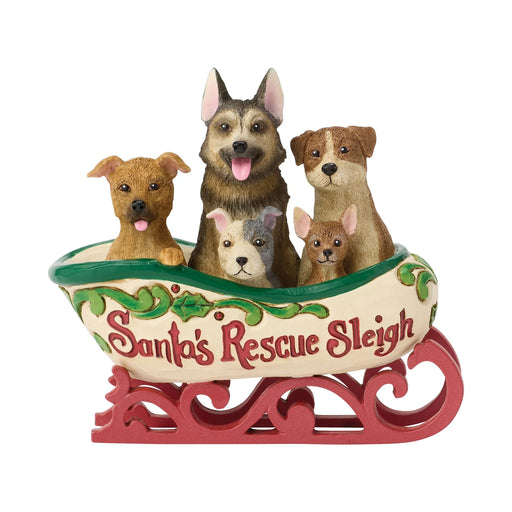 Decorative figurine of a sleigh with dogs inside with the phrase 'Santa's Rescue Sleigh' on a white background