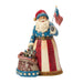 Decorative figurine of a patriotic Santa Claus holding an American flag on a white background