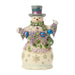 Decorative snowman figurine with top hat and colorful scarf on a white background