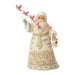 Santa figurine holding a birdhouse with flying cardinals on a white background