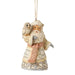 Decorative ornament of a Santa Claus figure with an owl on a white background