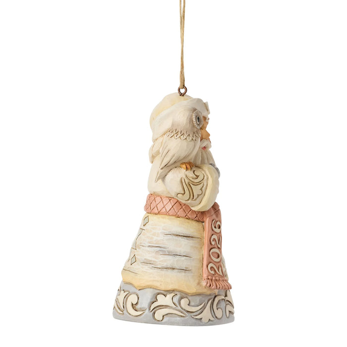 Decorative Santa Claus ornament with a white beard and pink robe on a white background