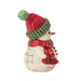 Snowman figurine with red and green hat and scarf holding a bell on a white background