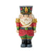 Mini festive Santa nutcracker figurine on a white background