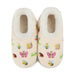 A pair of cream-colored fleece slipper boots decorated with colorful embroidered insects, including bees, butterflies, ladybugs, and snails, set against a plain white background.