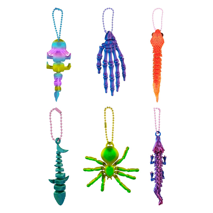 Colorful novelty items including a skeleton hand, spider, and other shapes on a white background