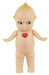 A vintage-style plastic baby doll with a pale peach skin tone, large dark eyes, and a small red heart-shaped badge on the chest that reads 'KEMPIE'.
