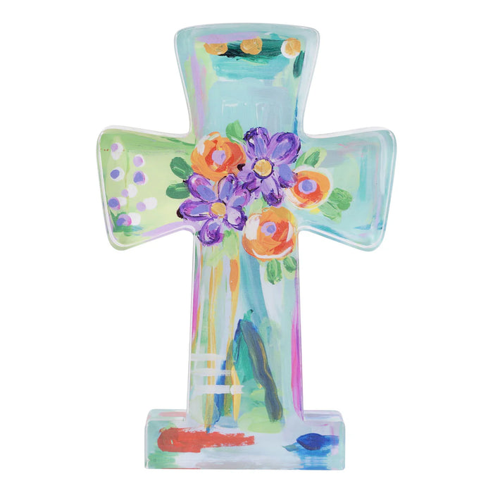 Decorative cross with floral design on a white background