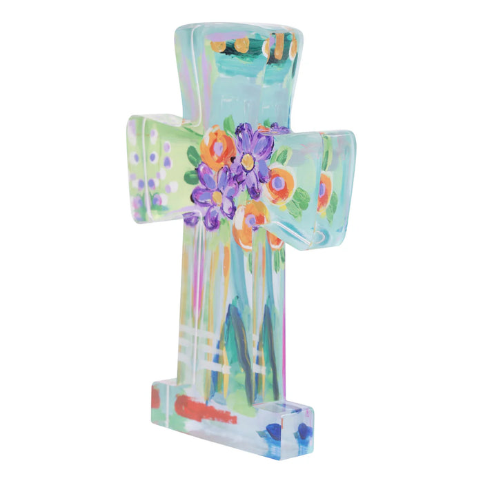 Decorative cross with floral design on a white background