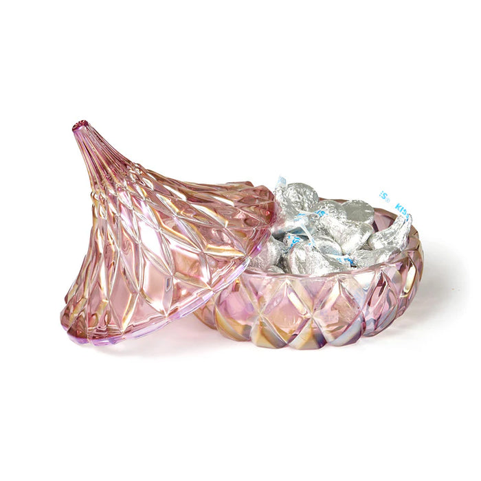 Iridescent glass candy dish with pink and purple hues on a white background