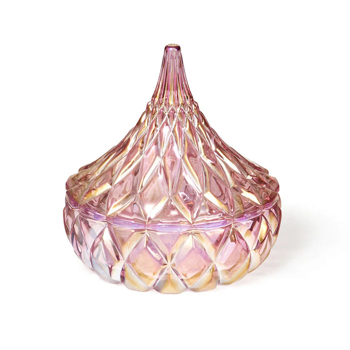 Pink glass candy container with diamond pattern on a white background