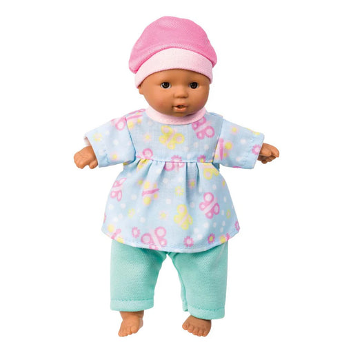 Baby doll with a floral top and light blue pants on a white background