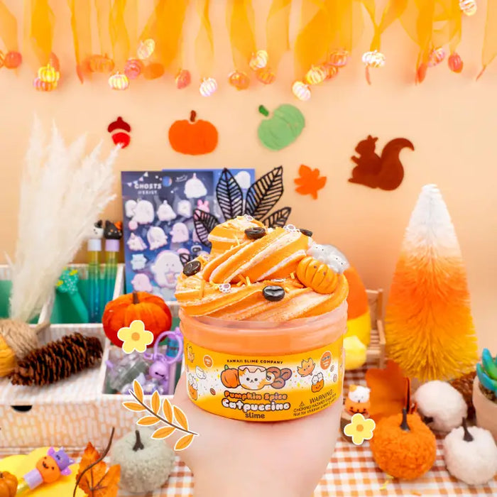 Jar of pumpkin spice ice cream with Halloween-themed decorations in the background
