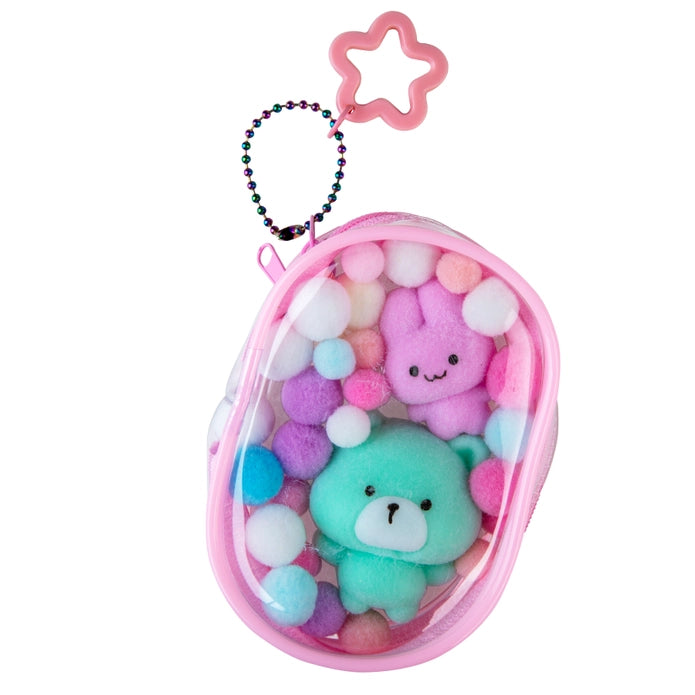 Pink case with plush toys and colorful beads on a white background