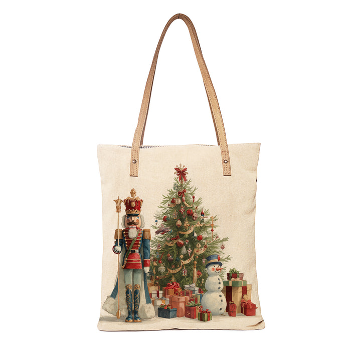 Tote bag with Christmas design featuring a nutcracker, tree, and snowman on a white background