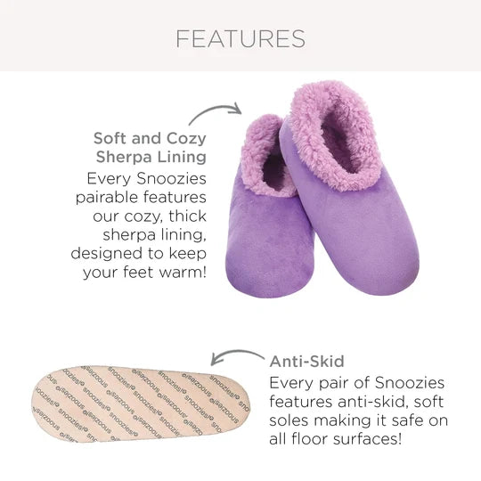Purple slippers with text describing soft and cozy sherpa lining and anti-skid soles on a white background.