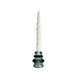 White spiral candle on a glass candlestick against a white background