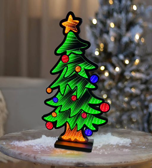 Decorative Christmas tree light on a wooden surface with a blurred festive background.