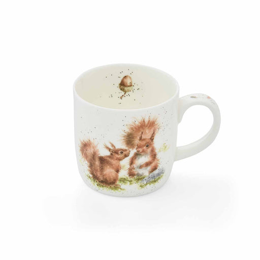 Candle in a mug with squirrel design on a white background