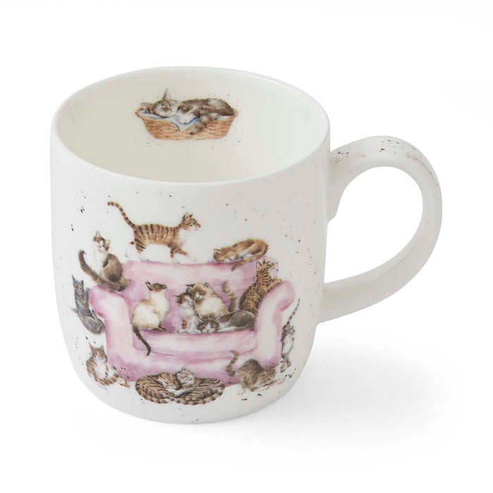White mug with cat-themed design on a white background