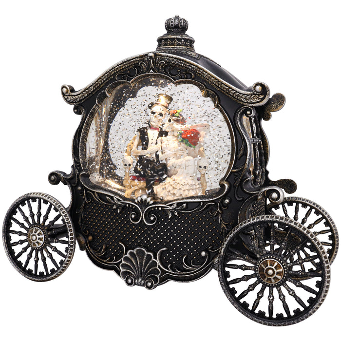 An ornate black and silver carriage-shaped snow globe featuring a couple in wedding attire inside, set against a plain white background.