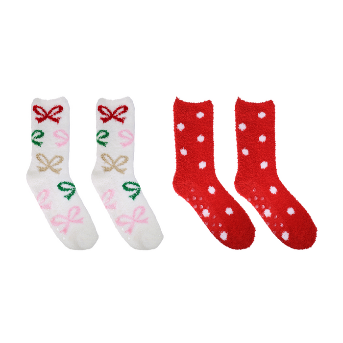 Two pairs of socks, one white with colorful designs and the other red with white polka dots, on a white background.